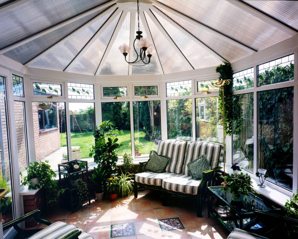 conservatory in basingstoke with a green garden